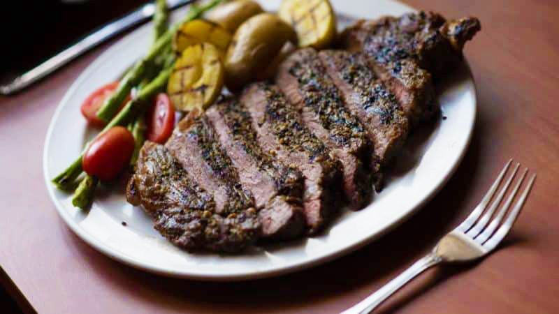 Steak dinner with grilled potatoes and asparagus